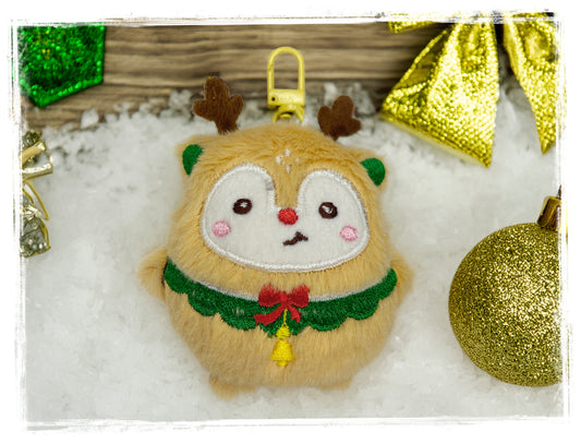 Tan reindeer plush Christmas keychain with green collar and red bow.