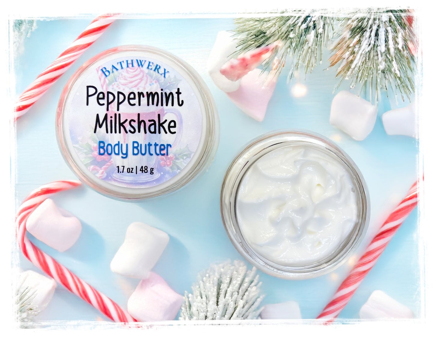 Bathwerx Peppermint Milkshake Body Butter with candy canes and marshmallows on a light blue background