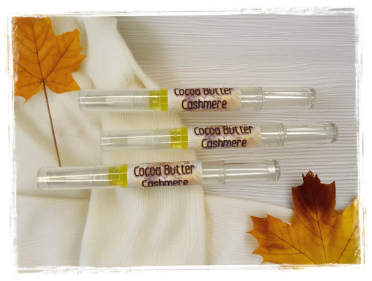Cocoa Butter Cashmere Nail & Cuticle Repair Pens set of three with autumn leaves on white background