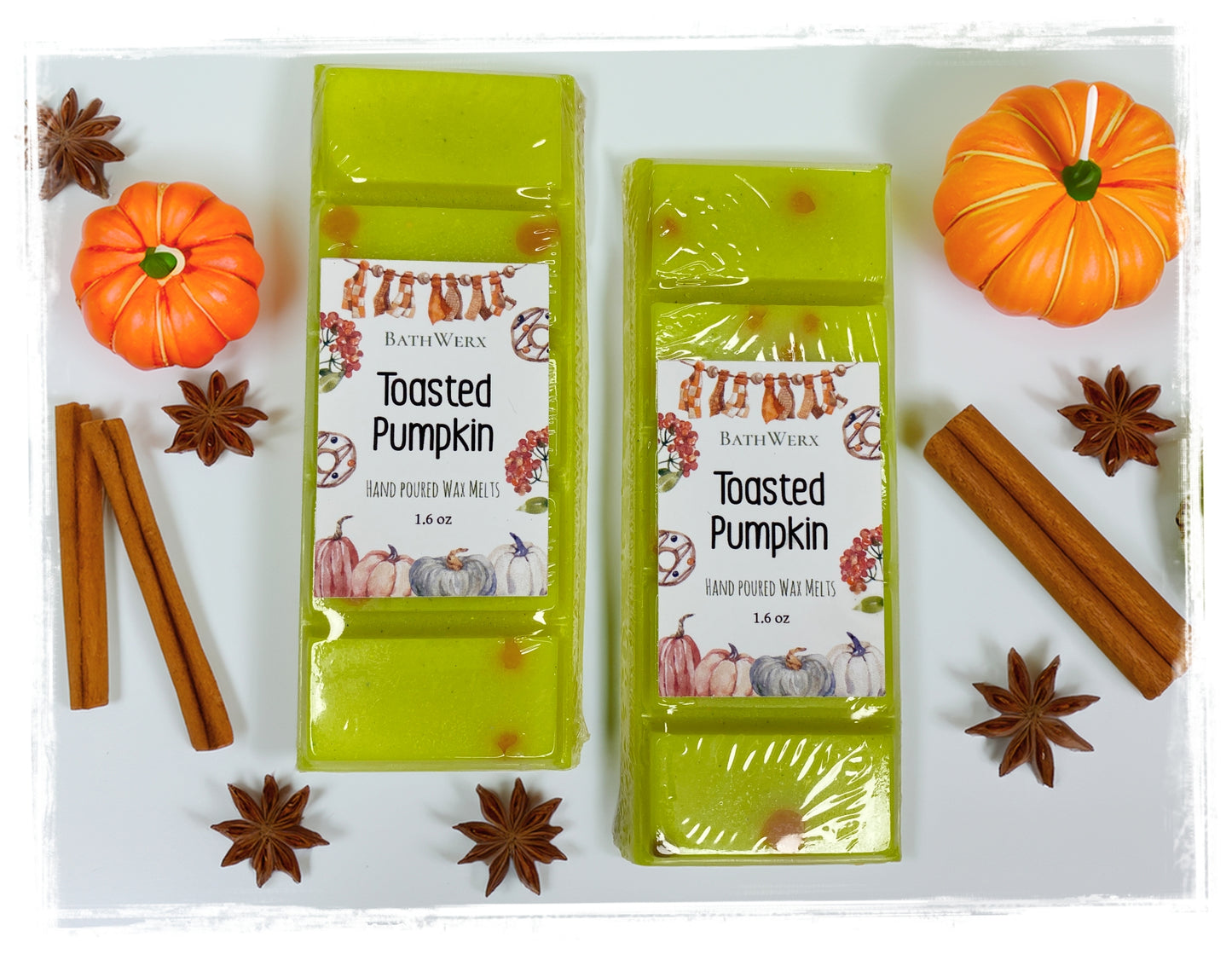 BathWerx Toasted Pumpkin hand poured wax melts, 1.6 oz, displayed with orange decorative pumpkins, cinnamon sticks, and star anise on a white surface.