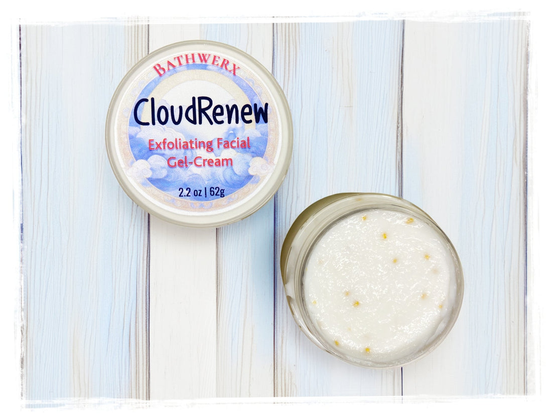 BathWerx CloudRenew Exfoliating Facial Gel-Cream 2.2 oz jar open and closed on a white wood surface showing cream texture with jojoba beads.