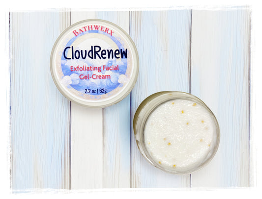 BathWerx CloudRenew Exfoliating Facial Gel-Cream 2.2 oz jar open and closed on a white wood surface showing cream texture with jojoba beads.