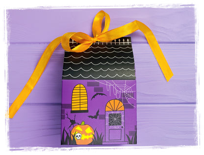 Halloween Boo Box gift set in a purple haunted-house box with orange ribbon, bats, spiderwebs, and a pumpkin.