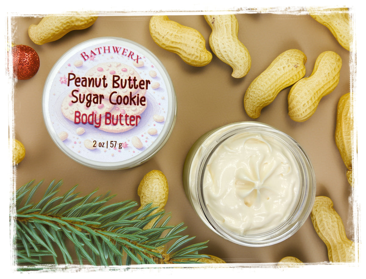 BathWerx Peanut Butter Sugar Cookie Body Butter, shown in an open jar beside its labeled lid with peanuts and an evergreen sprig.
