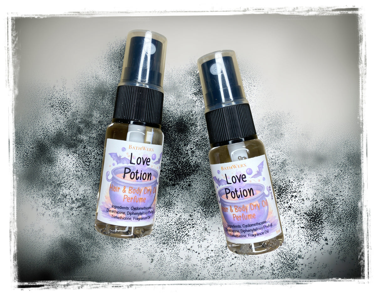 Two Love Potion Hair & Body Dry Oil spray bottles with purple Halloween labels and clear caps.