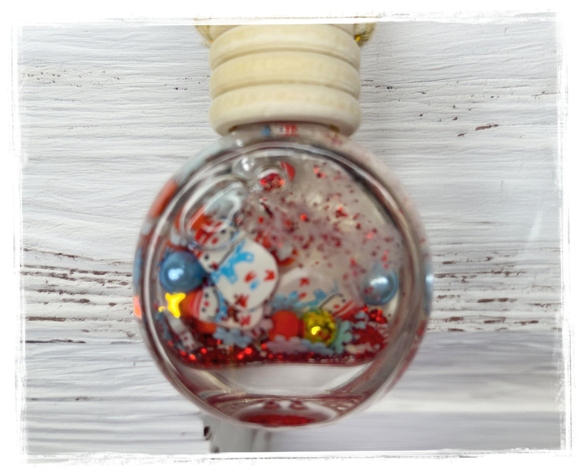 Candy Cane Cloud car charm in a round glass bottle with a wooden cap and colorful holiday accents.