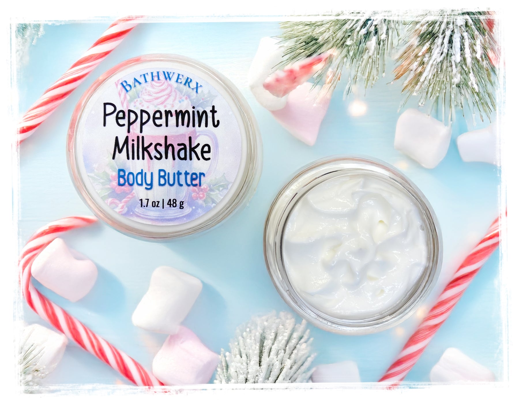 Bathwerx Peppermint Milkshake Body Butter with candy canes and marshmallows on a light blue background