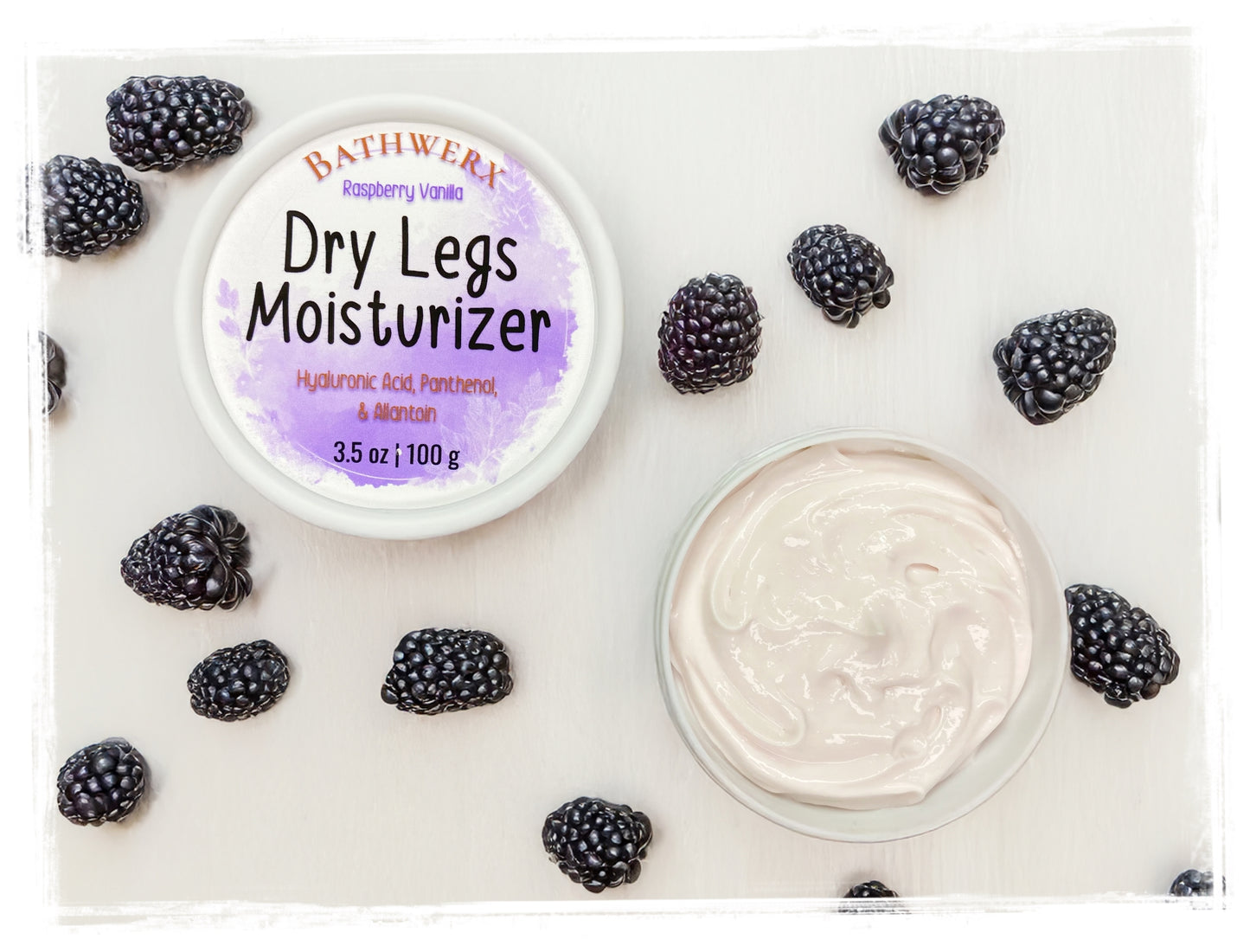 BathWerx dry legs moisturizer with blackberries on a white background