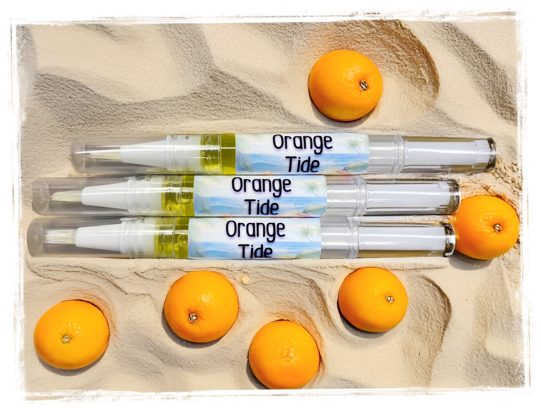 Orange Tide scented nail and cuticle repair pens with fresh oranges - portable cuticle oil treatment