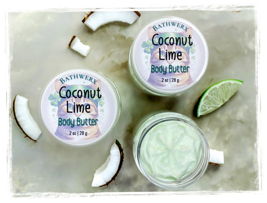 Bathwerx Coconut Lime body butter with coconut and lime slices on a marble surface