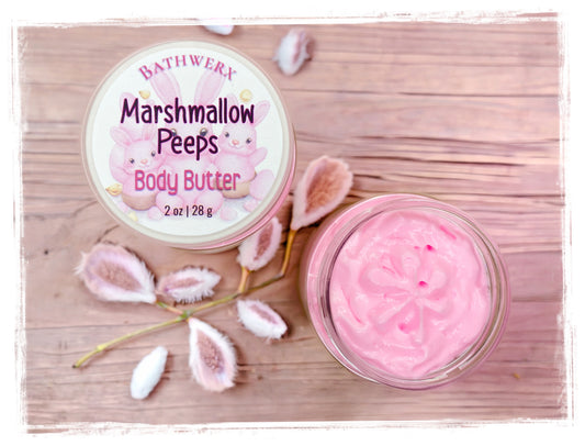 BathWerx Marshmallow Peeps Body Butter — open 2 oz jar showing whipped pink body butter, styled with dried pink botanicals on a rustic wood surface