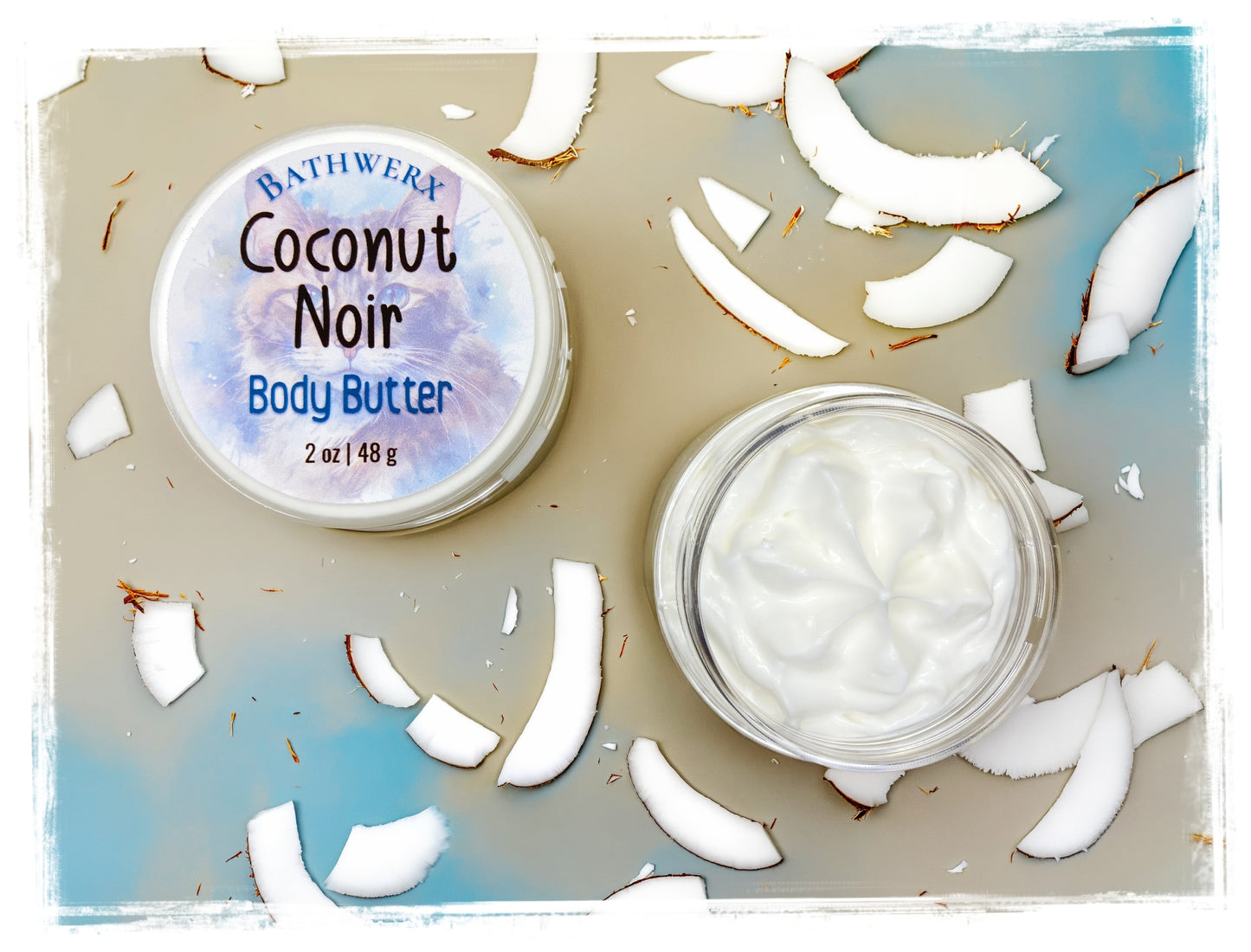 BathWerx Coconut Noir Body Butter jar and lid flat-lay – 2 oz with fresh coconut pieces
