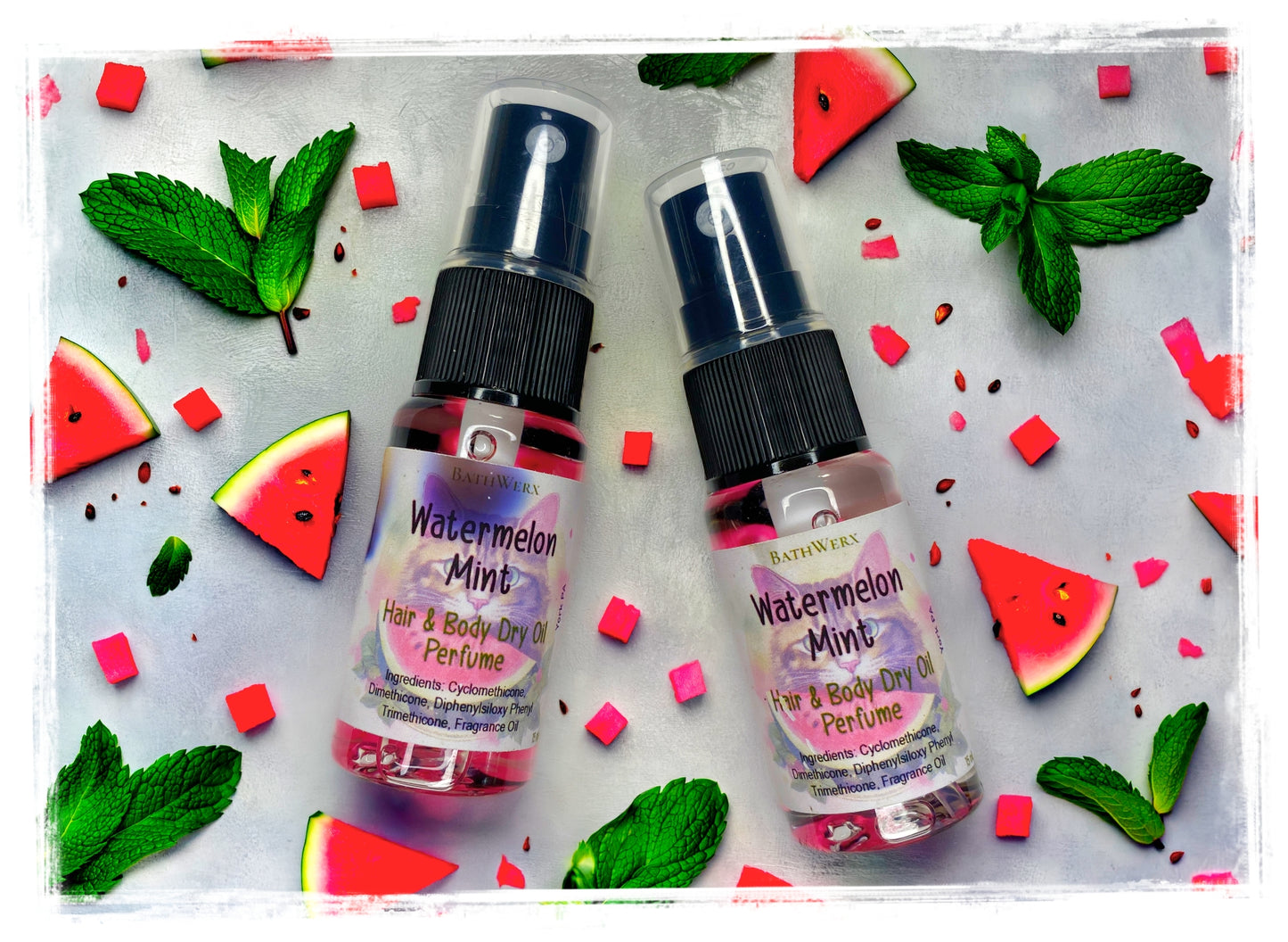 BathWerx Watermelon Mint Hair and Body Dry Oil Perfume spray bottles flatlay with watermelon and mint