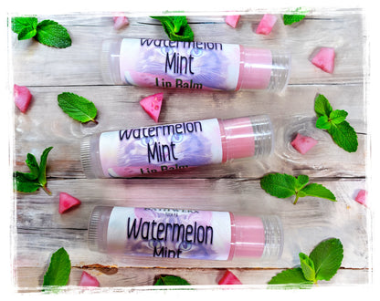 BathWerx Watermelon Mint Lip Balm three tubes flatlay with mint leaves and watermelon accents
