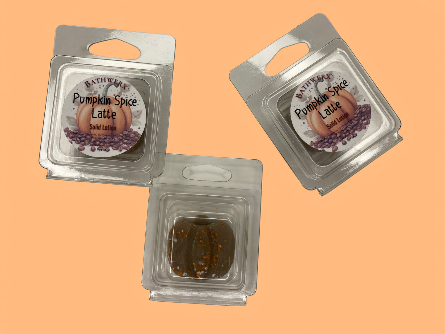 BathWerx Pumpkin Spice Latte Solid Lotion bars in clear clamshell packaging, center bar shown revealing a brown lotion bar - .5 oz