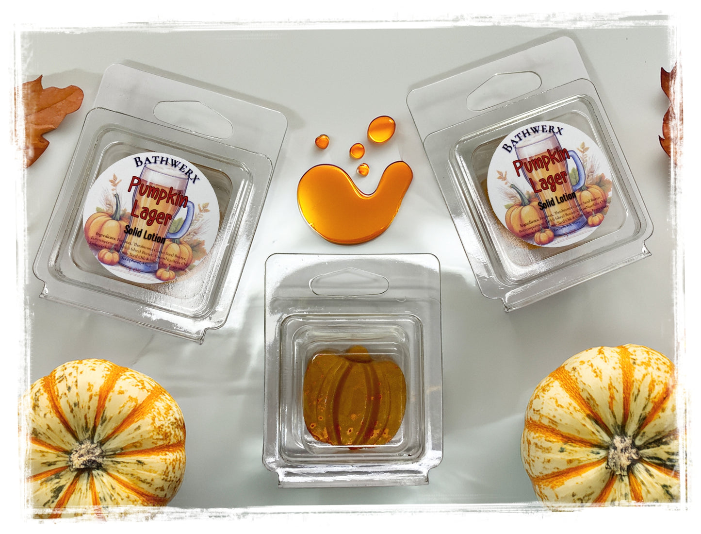 BathWerx Pumpkin Lager Solid Lotion in clear clamshell packaging with amber lotion bars and autumn gourds.