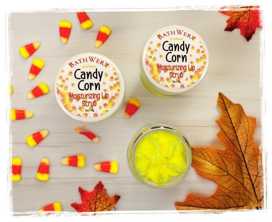 BathWerx Candy Corn Moisturizing Lip Scrub 0.5 oz jars with bright yellow sugar scrub texture, surrounded by candy corn pieces and fall maple leave